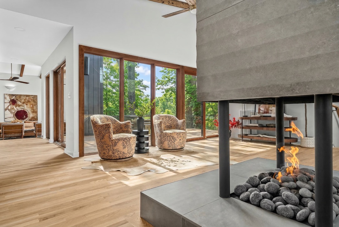 Double-sided fireplace and sunlit sitting area