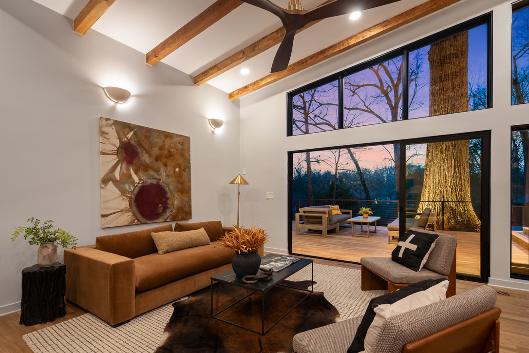 Living room opening to the deck at dusk
